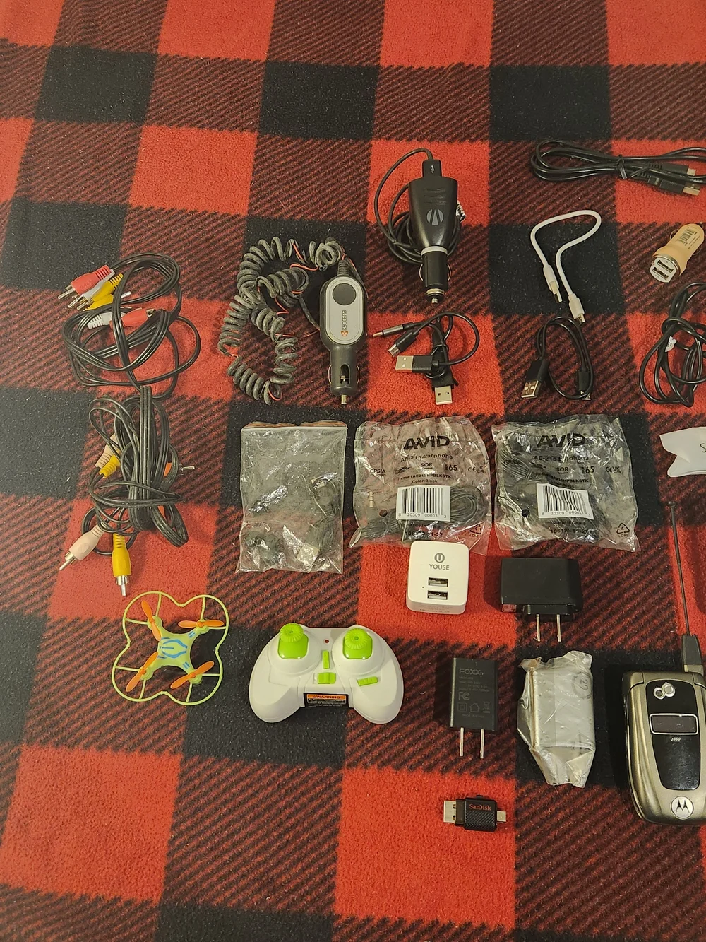 Elctronics Lot, Cellphones, Charging Cords, Remotes, And More